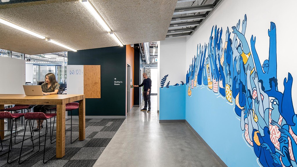 Meta Park Tower open collaboration space, Mother's room, and blue wall graphic.