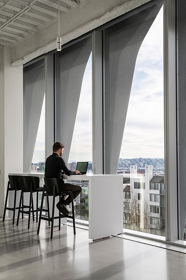 A man working by the window at 633 Folsom.