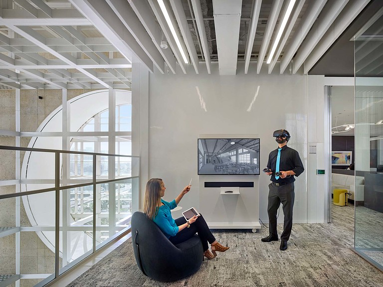 A man and a woman in an office.
