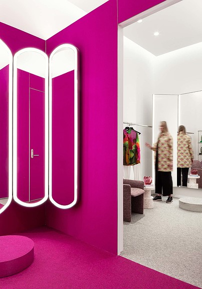 Magenta colored fitting room in Holt Renfrew The Studio