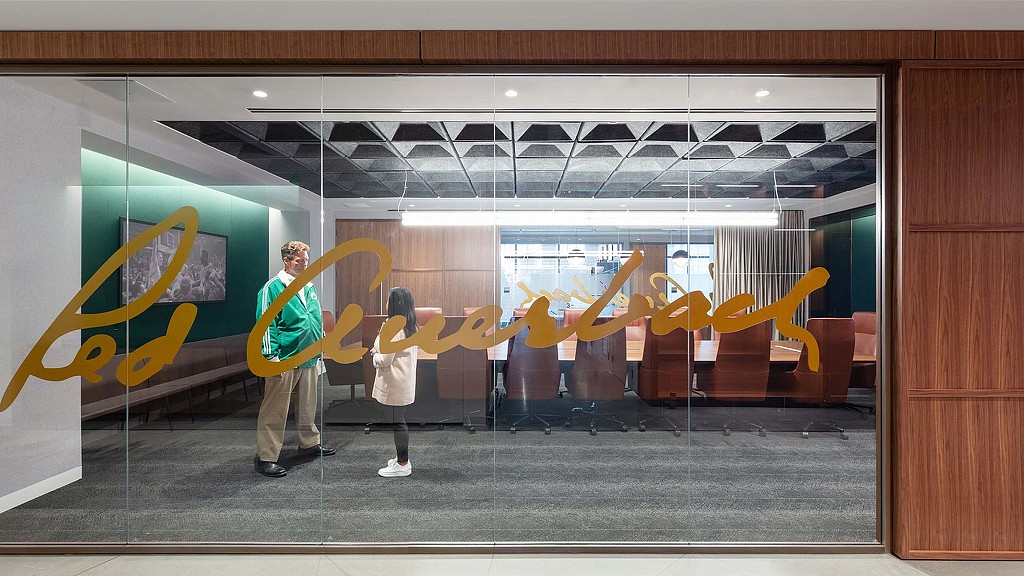 Conference room with environmental graphics on the glass in the Boston Celtics workplace