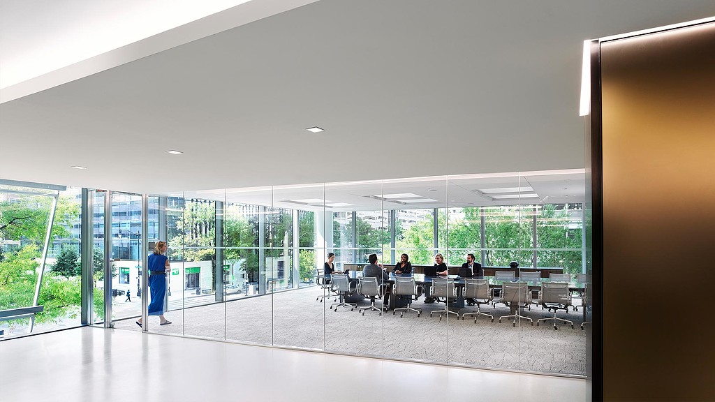 Large glass conference room on 2nd floor with views of trees