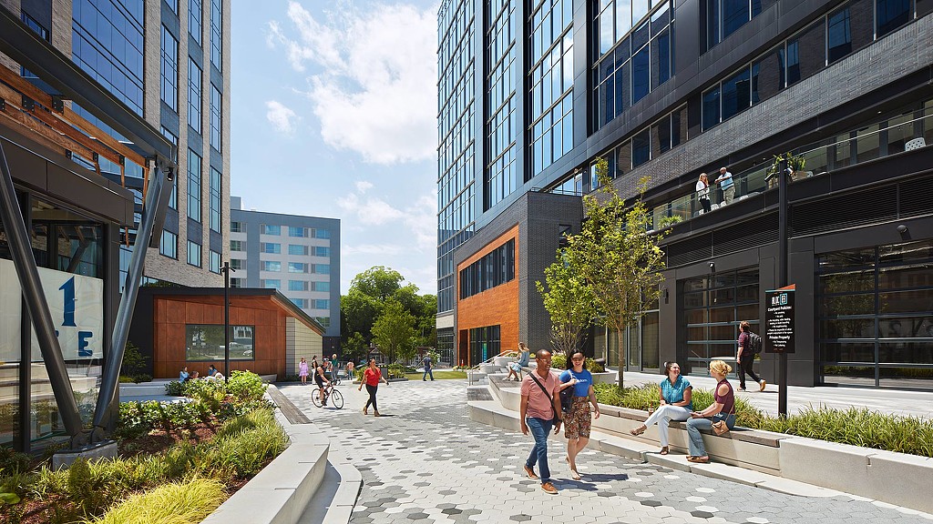 Bloc[83] activated walkway between buildings