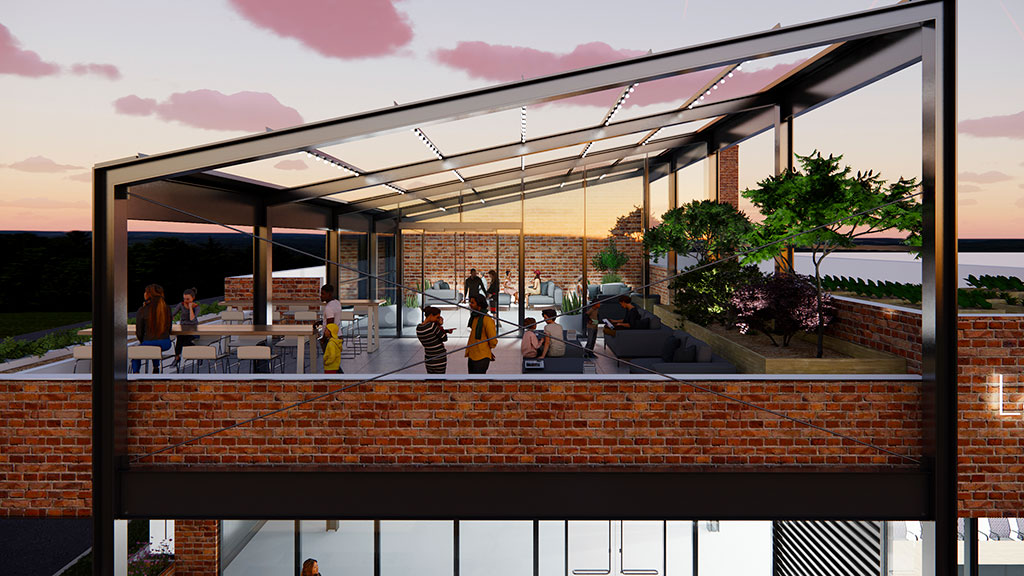 A group of people sitting on a patio with a brick wall and a building with a glass wall.