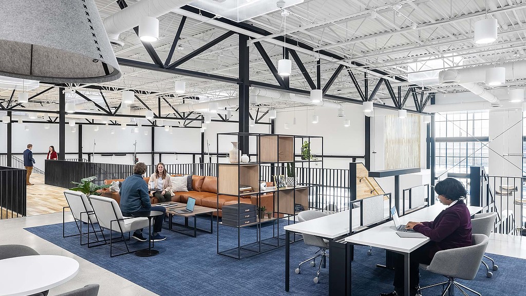 People sitting at tables in a room.