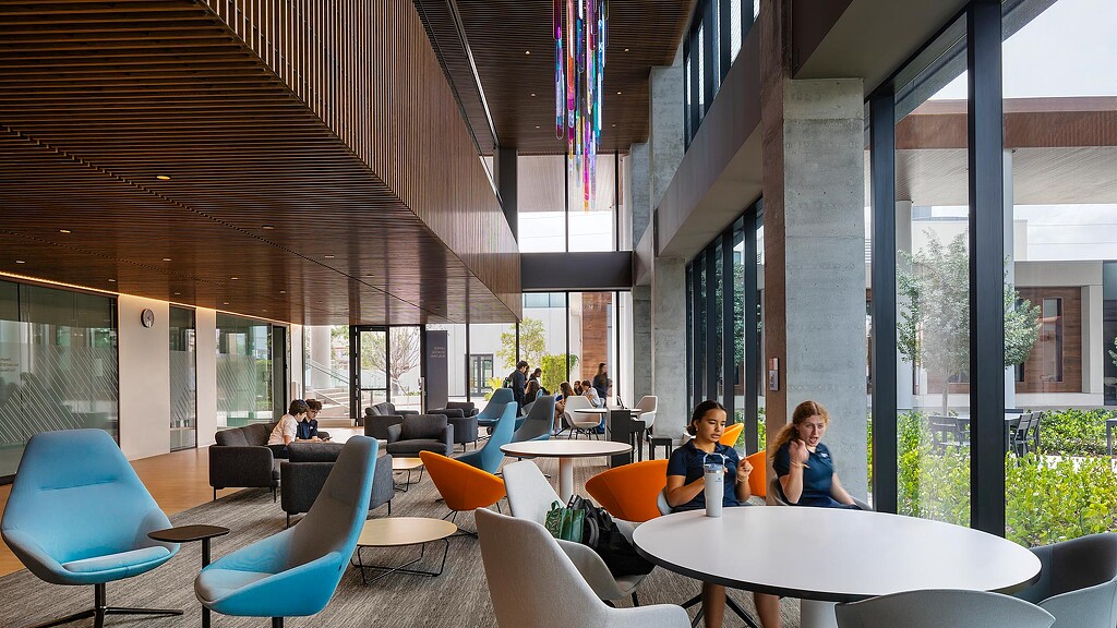 People sitting at tables in a building.