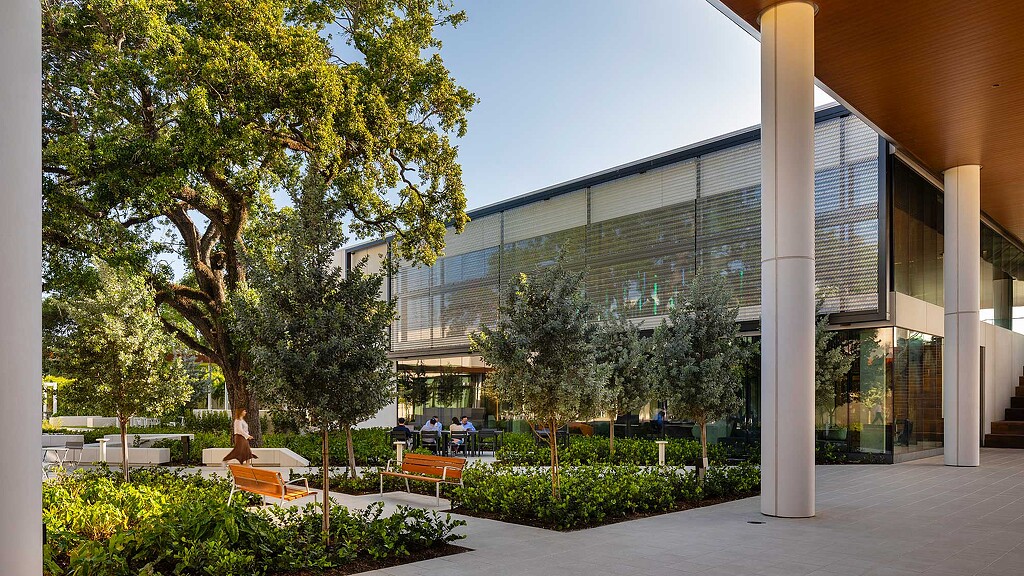 A building with trees and benches.