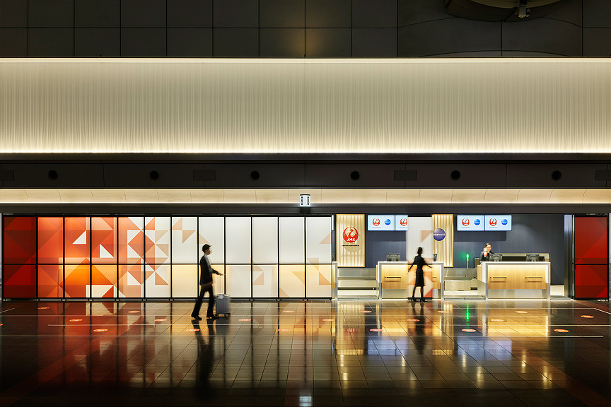 Japan Airlines check-in area with origami-inspired digital graphics