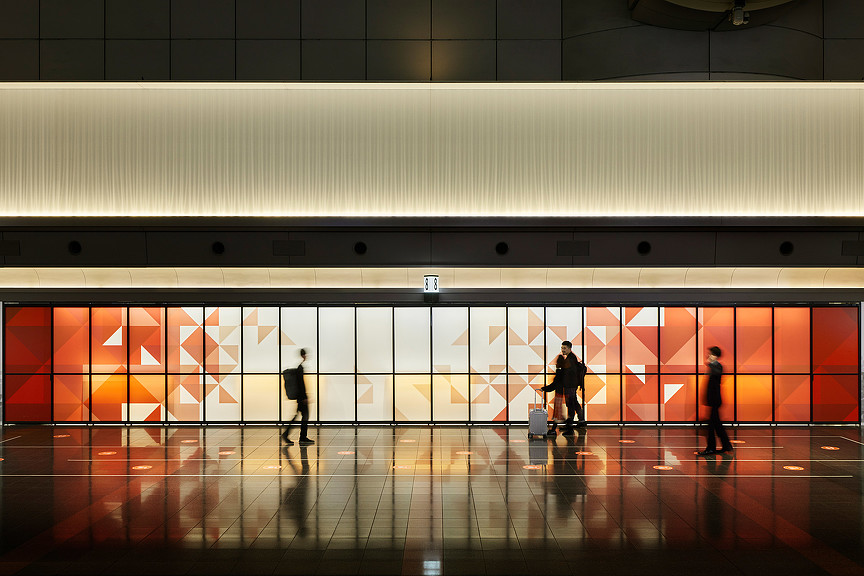 Japan Airlines check-in area with origami-inspired digital graphics