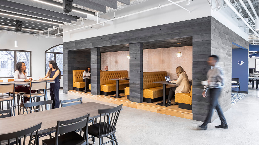 Semi-private booths in an open area office space