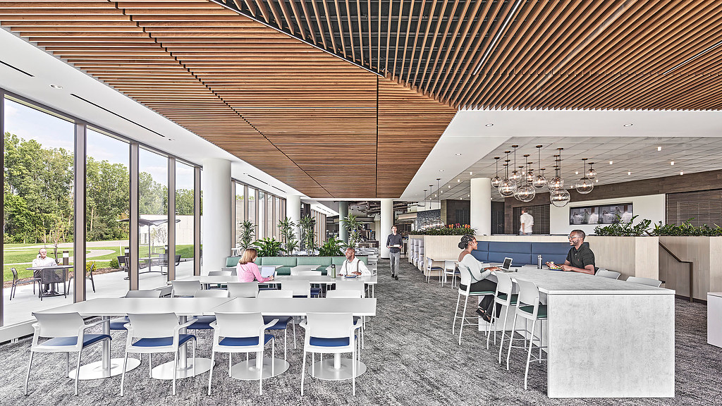 Open seating in an interior work space with wooden ceiling