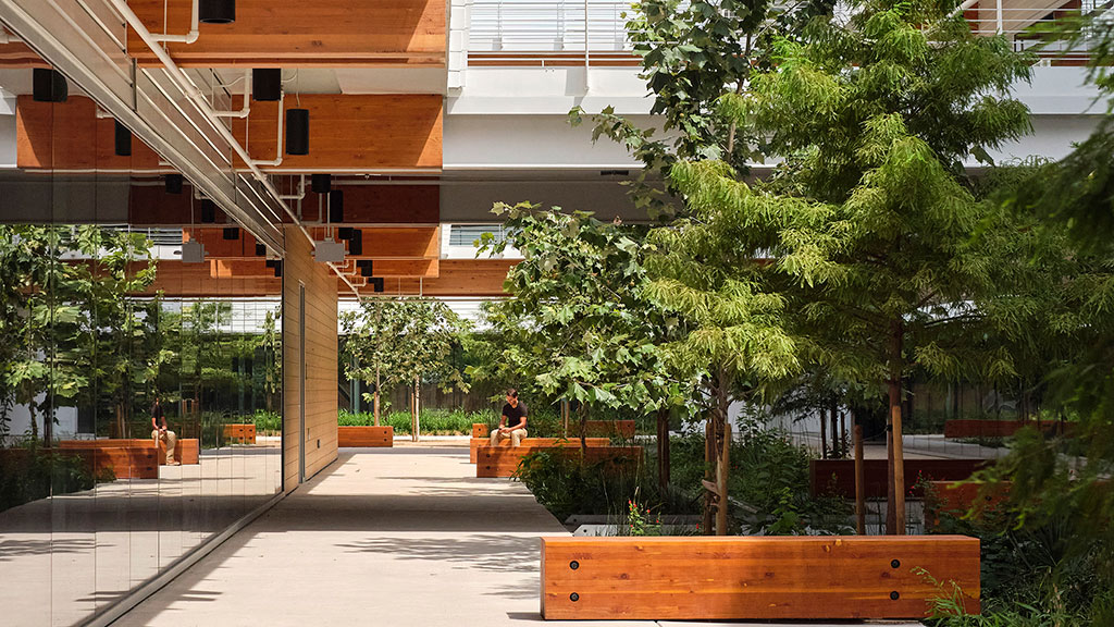 A building with trees and benches.