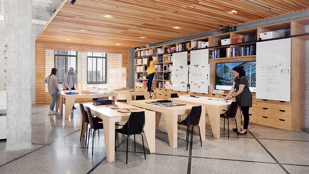 A group of people in a library.