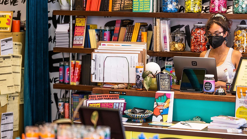 Chapter 510 Swan's Market merchandise and woman at counter