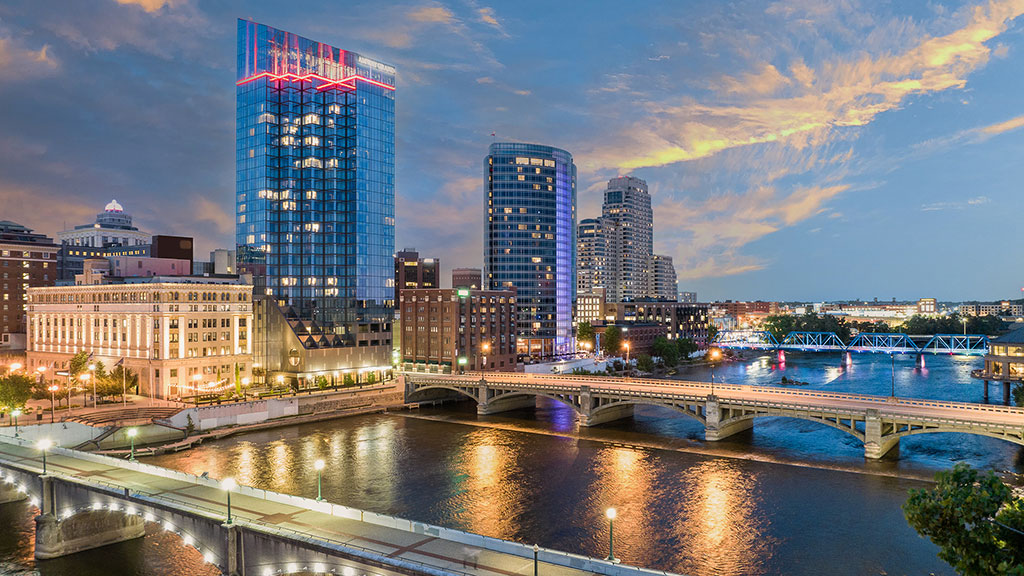 A city with a bridge and water.