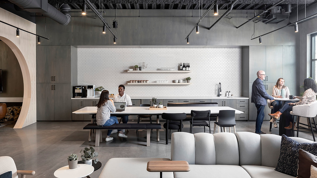 An open cafe area at a showroom and modern office working space with warm touches