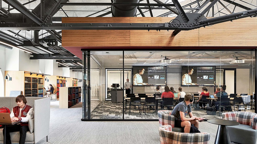 A glass classroom and casual seating in a larger room at Kentucky University Commons Helm Library