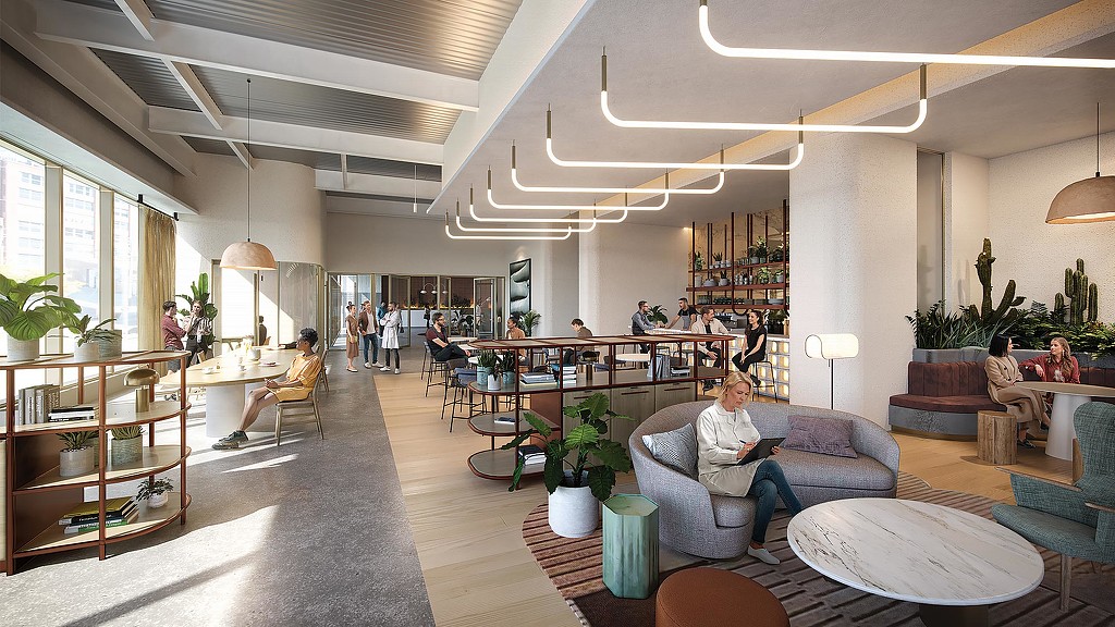 A large room with people sitting in it.