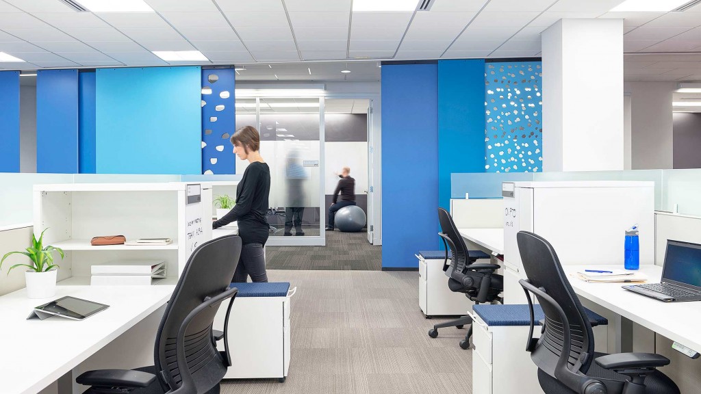A person standing in an office.