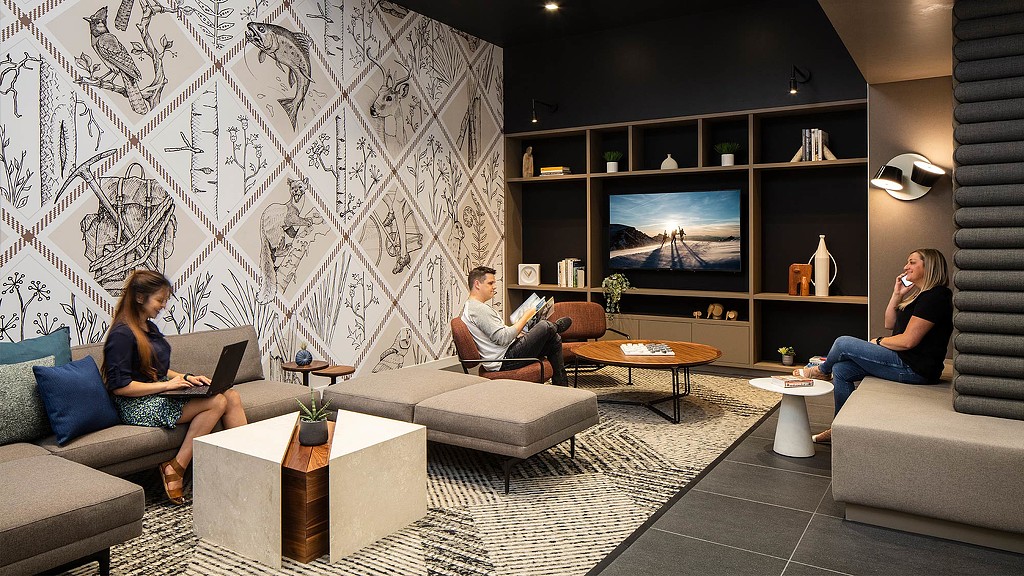 A group of people sitting in a living room.