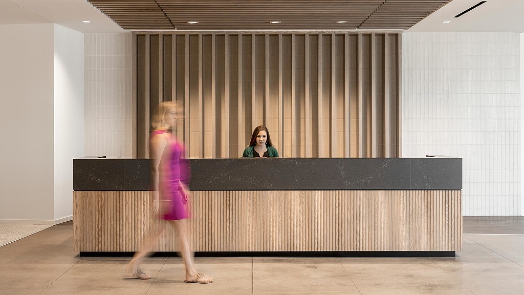 A woman standing at a podium.