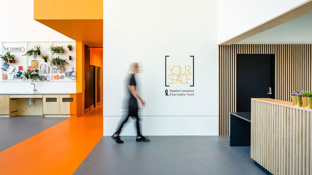 A man walking in a room.