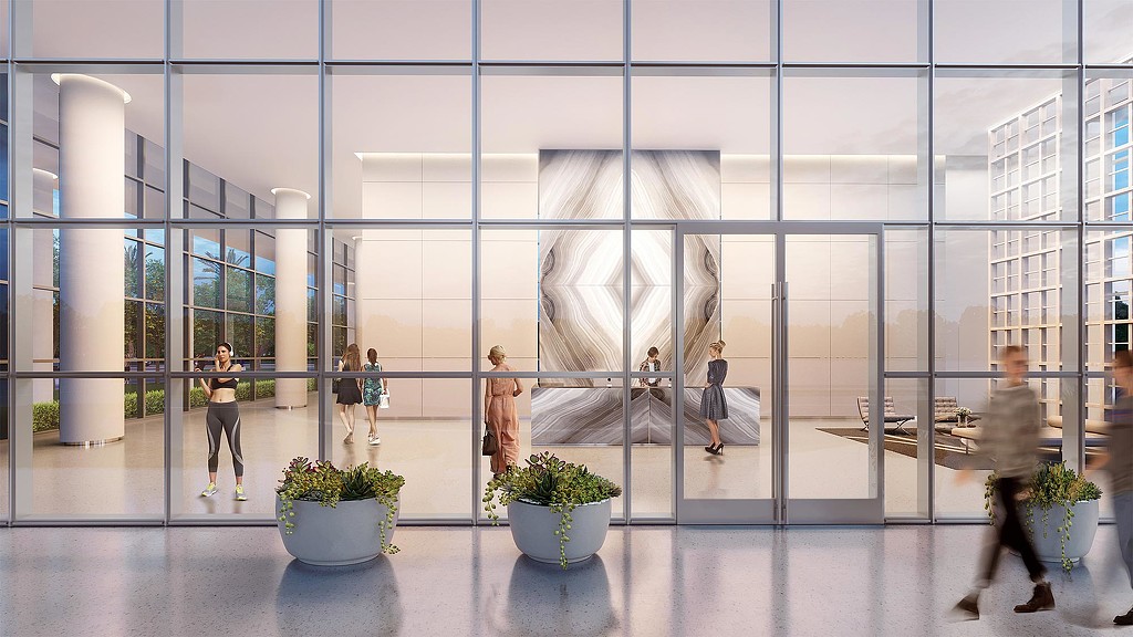 A group of people walking through a building.