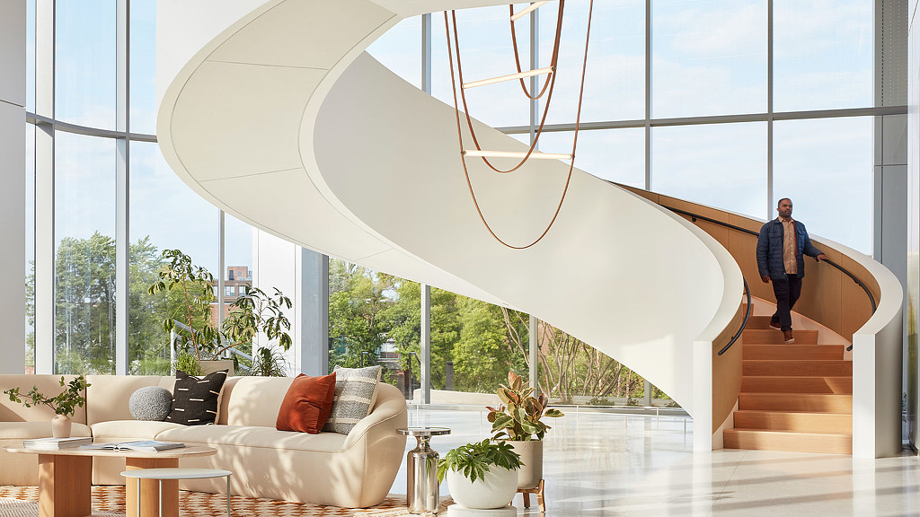 A sitting area and a large spiral staircase at 1229 W Concord