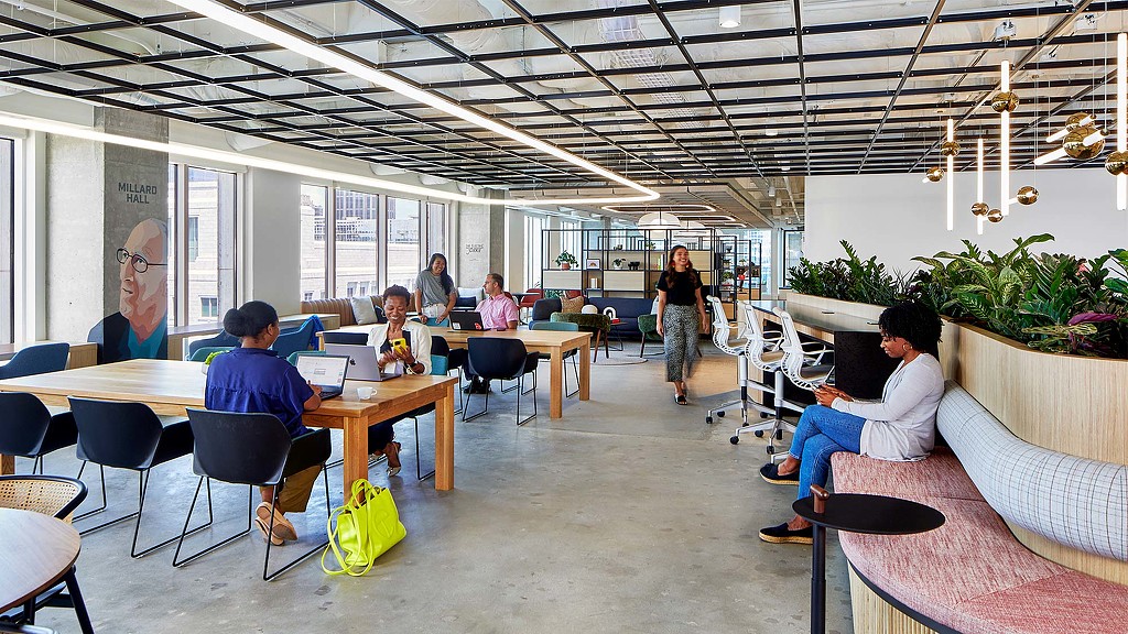 People sitting at tables in a room.