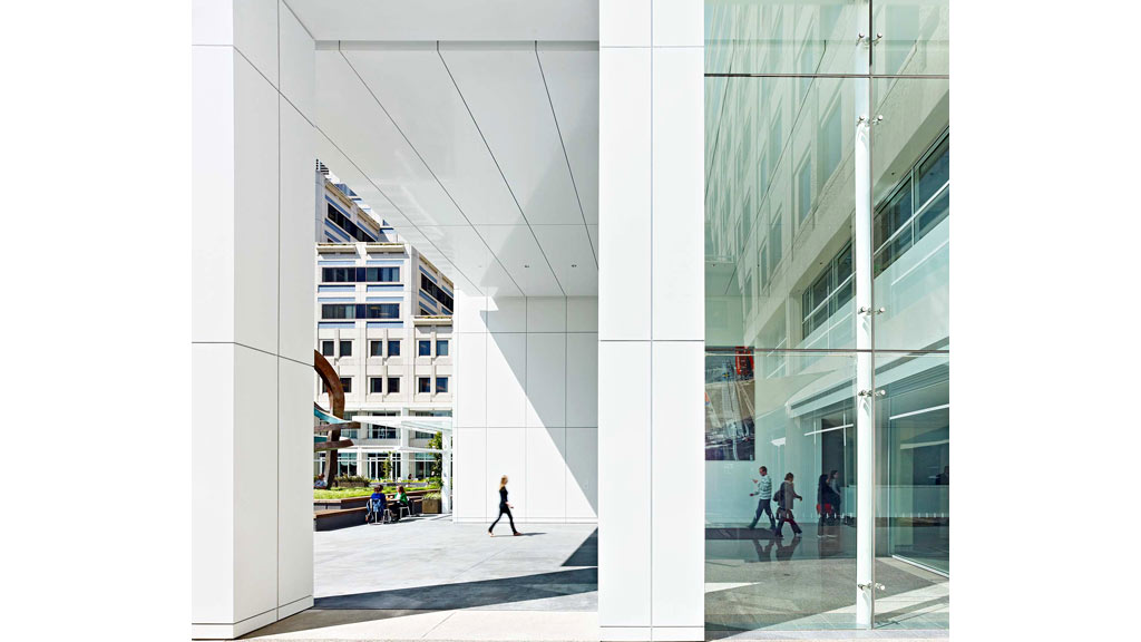 A group of people walking in a large building.