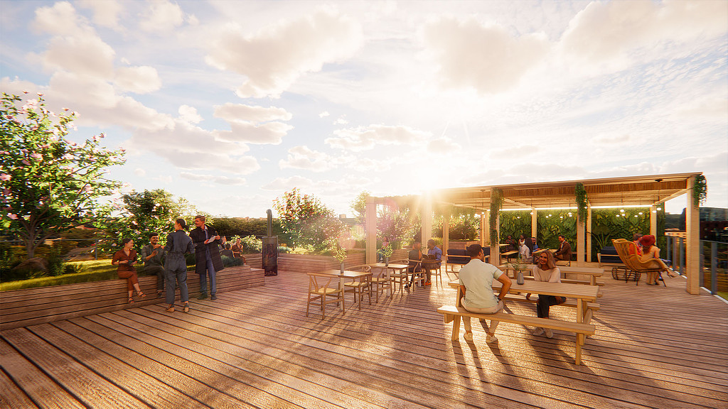 A group of people sitting at tables on a deck.