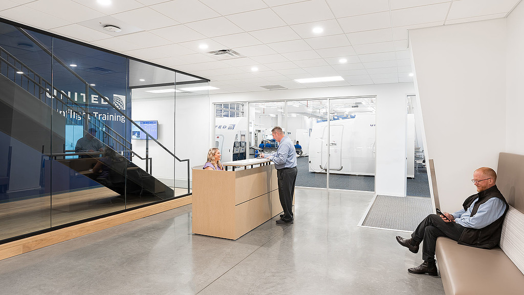 A few people in an office.