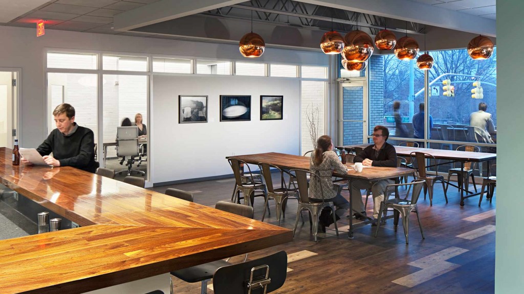 A group of people sitting at tables.