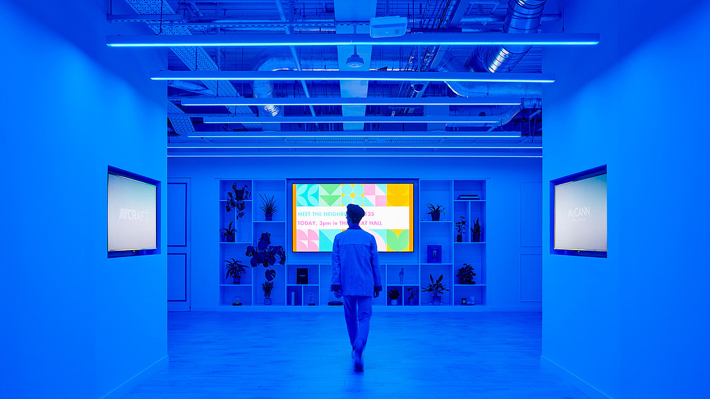 McCann Worldgroup hallway with blue lighting and digital screen