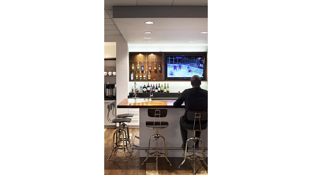 A person sitting at a bar.