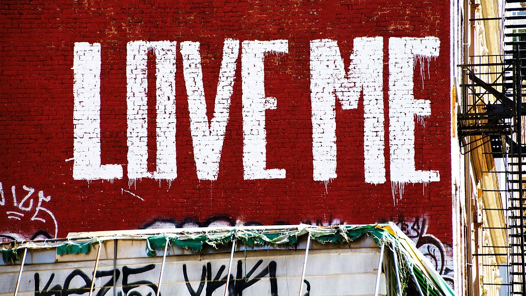 Love Me on brick wall in Tribeca. Credit: Unsplash