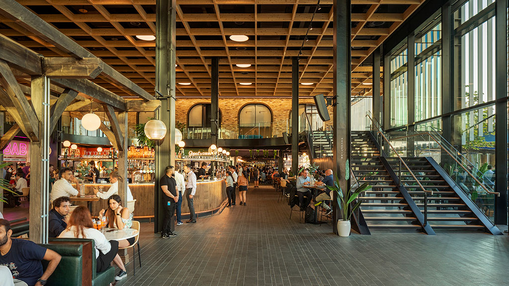 People sitting at tables in a building.
