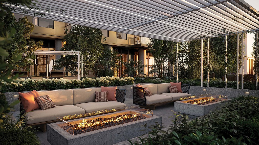 A large outdoor patio with a fire pit and plants.
