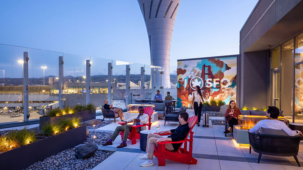 A group of people sitting outside.