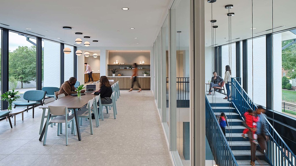 People sitting at tables in a building.