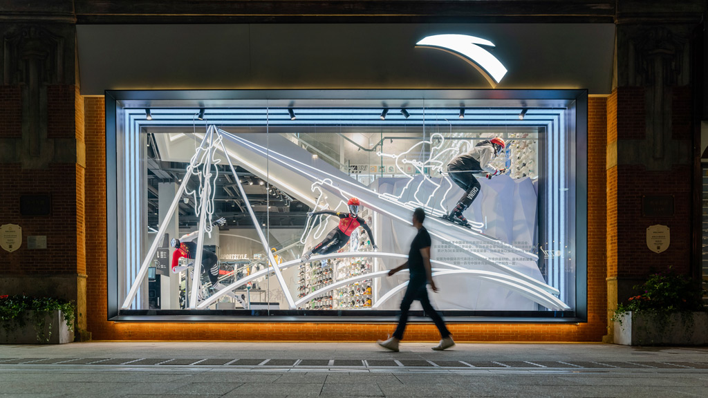 A person walking past a window.