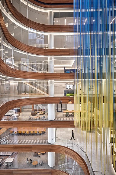 Capital One McLean Block A glass atrium with blue and yellow hanging artwork