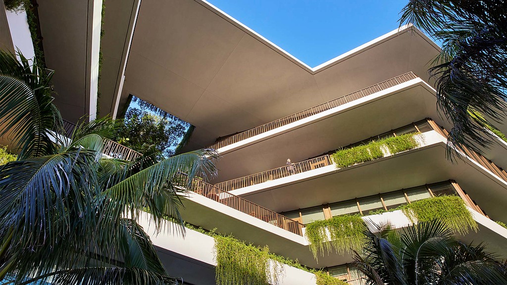 A building with trees and bushes.