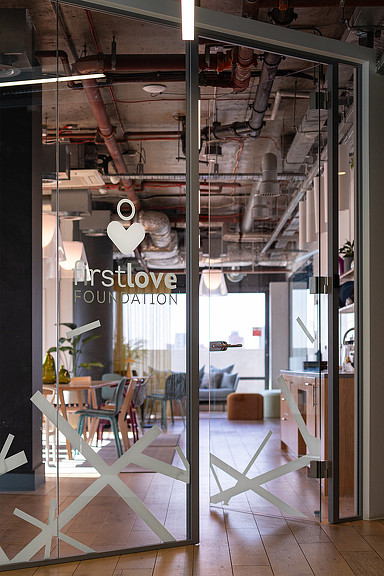 First Love Foundation logo decal on glass door