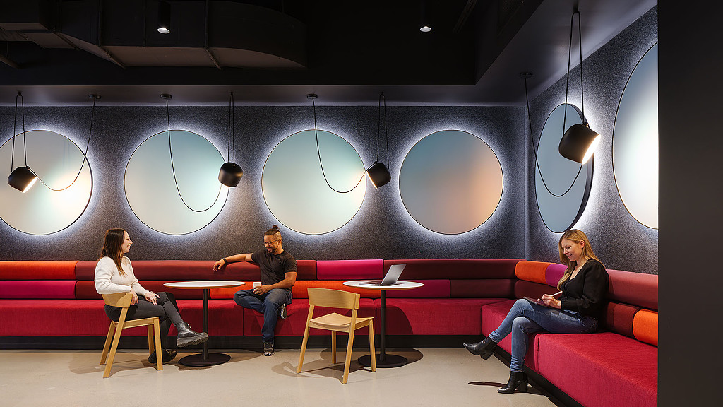 A group of people sitting on a couch.