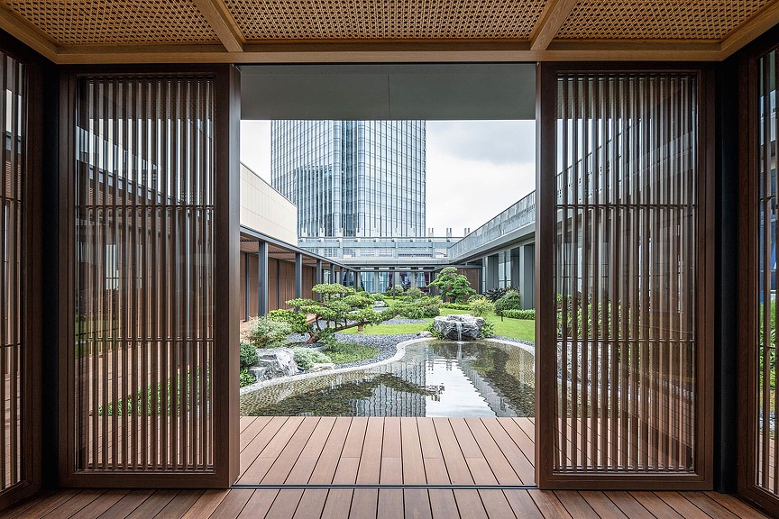 Avary Time Center courtyard view from inside sliding wood slated doors