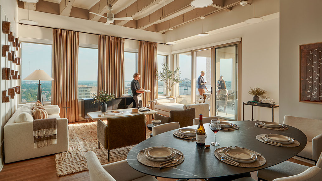 A dining room with a large window.