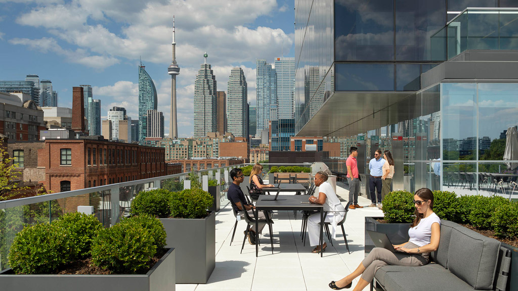 People sitting at a table outside.