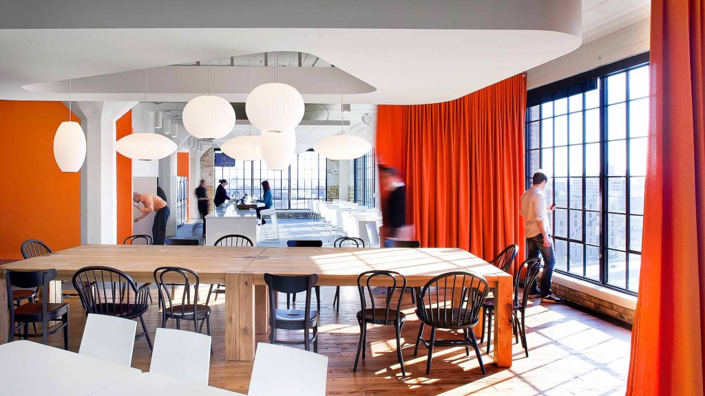 A room with tables and chairs.