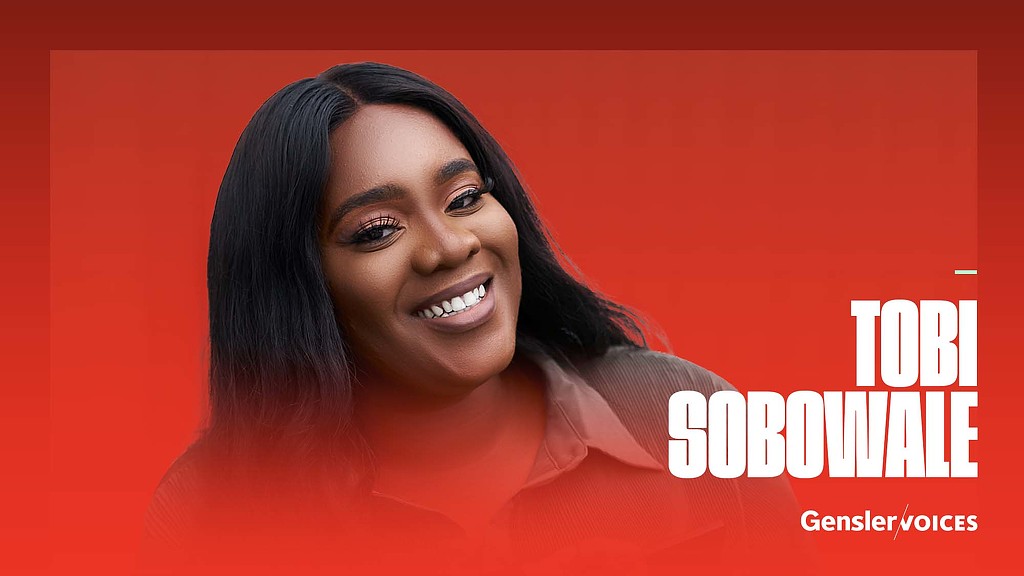 A woman smiling for the camera.